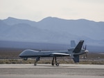 A U.S. Air Force MQ-9 Reaper remotely piloted aircraft, assigned to the 432nd Wing, taxis toward the runway at Creech Air Force Base, Nevada, April 15, 2025. The MQ-9's capabilities make it uniquely qualified to conduct irregular warfare operations in support of combatant commander objectives.