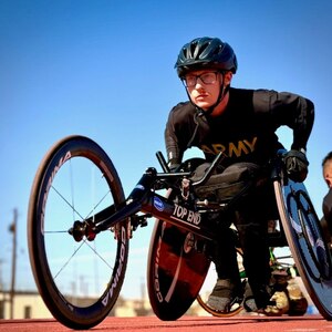 Army Spc. Syd Cavanagh is getting his mind and spirit aligned in his track wheelchair as he says before track events at the Army Trials, April 5, 2025, Fort Bliss, Texas.