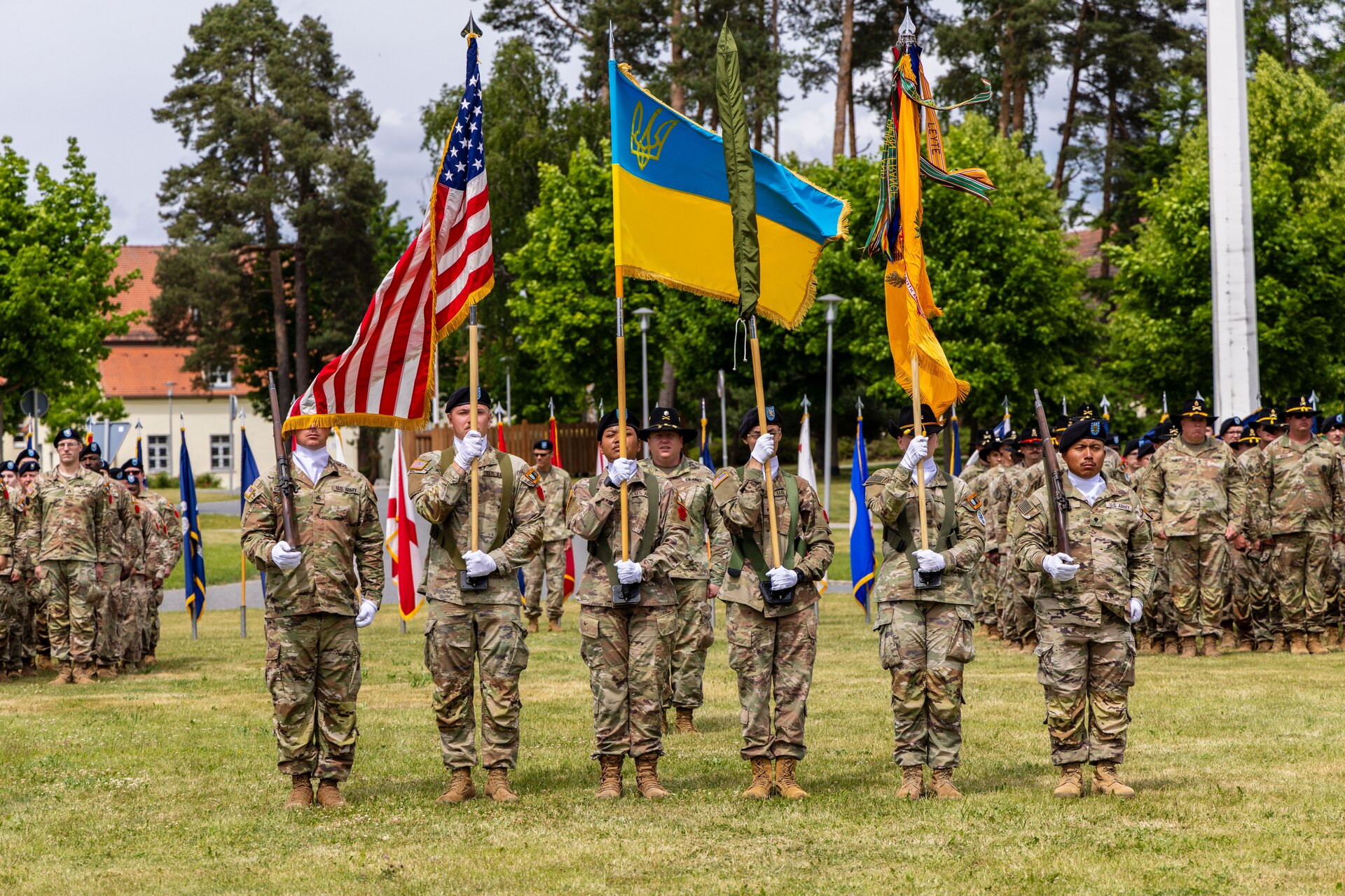 The color guard stands during the Joint Multinational Training Group-Ukraine transfer of authority ceremony with the 278th Armored Cavalry Regiment colors uncased at the Joint Multinational Training Group-Ukraine transfer of authority ceremony at Tower Barracks, Grafenwoehr, Germany, June 1, 2025. The ceremony commemorated the transfer of the JMTG-U mission from the 56th Stryker Brigade Combat Team, Pennsylvania National Guard, to the 278th ACR, Tennessee National Guard. (U.S. Army National Guard photo by Capt. Leanne Demboski)