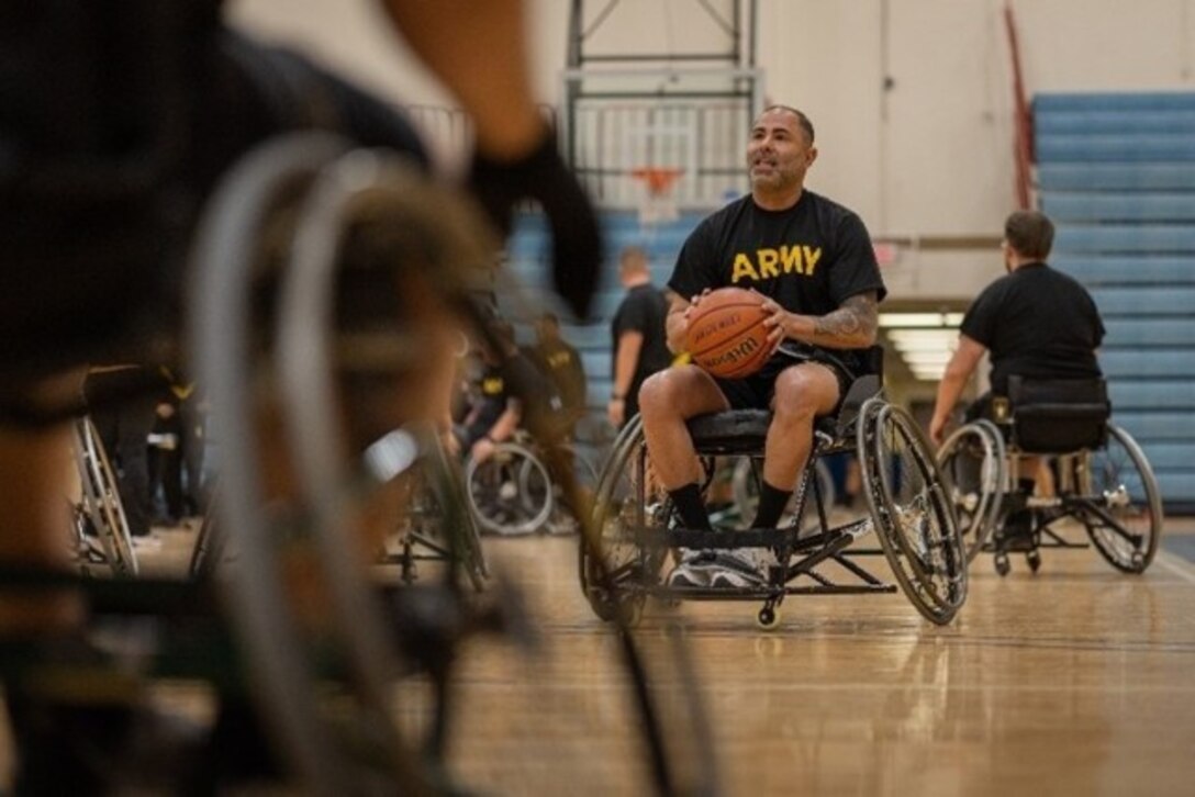 U.S. Army Capt. Carlos Rivera prepares to shoot the basketball during wheelchair basketball at the 2025 Army Trials, Fort Bliss, Texas, April 3, 2025.