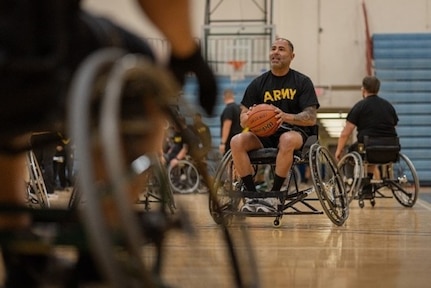 U.S. Army Capt. Carlos Rivera prepares to shoot the basketball during wheelchair basketball at the 2025 Army Trials, Fort Bliss, Texas, April 3, 2025.