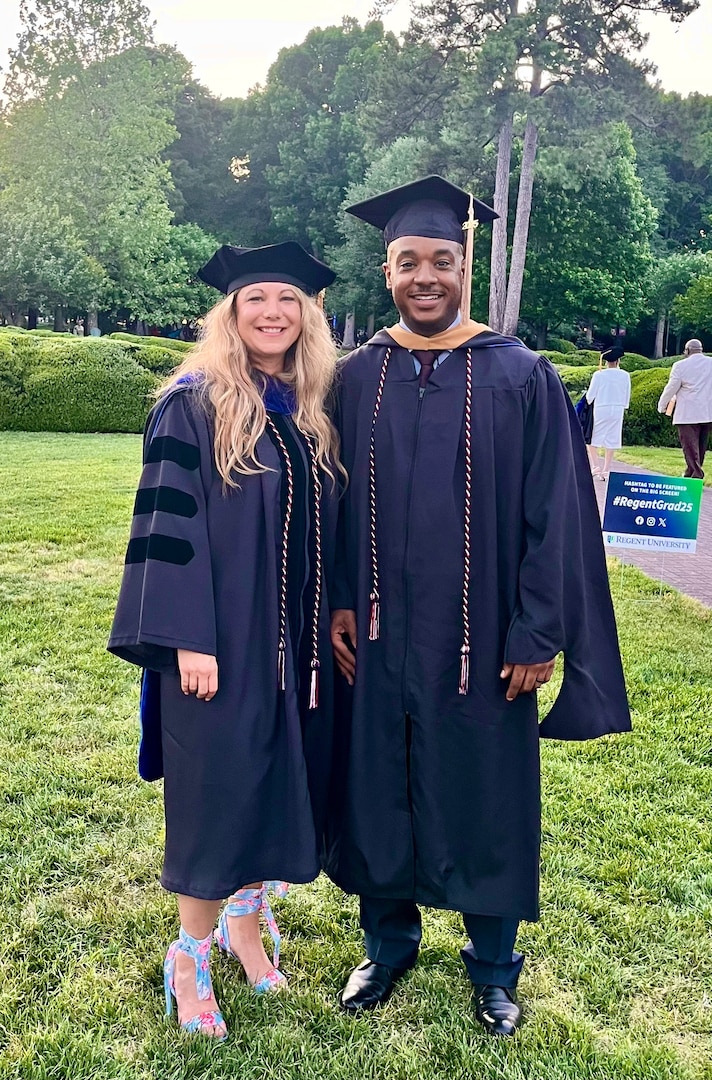 U.S. Air Force 1st Lt. Kristy Winkler, Medical Administration Officer, 113th Wing Medical Group, stands for a photograph with Master Sgt. Malcolm Williams, a medic also assigned to the 113th Wing, during a commencement ceremony in Virginia Beach, VA, on May 10, 2025. 1st Lt. Winkler completed a Doctor of Strategic Leadership (DSL) with the assistance of the District of Columbia National Guard Tuition Assistance Program.