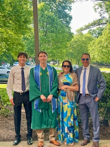 Senior Airman Corbin Phillips, crew chief within the 113th Wing Maintenance Squadron, D.C. Air National Guard, stands for a photograph with his family following a commencement ceremony, in Fairfax, VA, on May 15, 2025. SrA Phillips completed a Bachelor of Science in Systems and Industrial Engineering with the assistance of the District of Columbia National Guard Tuition Assistance Program.