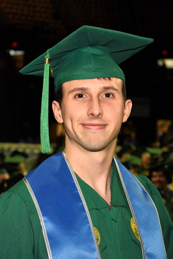 Senior Airman Corbin Phillips, crew chief within the 113th Wing Maintenance Squadron, D.C. Air National Guard, stands for a photograph during a commencement ceremony, in Fairfax, VA, on May 15, 2025. SrA Phillips completed a Bachelor of Science in Systems and Industrial Engineering with the assistance of the District of Columbia National Guard Tuition Assistance Program.