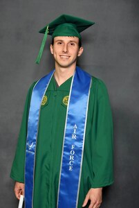 Senior Airman Corbin Phillips, crew chief within the 113th Wing Maintenance Squadron, D.C. Air National Guard, stands for a photograph during a commencement ceremony, in Fairfax, VA, on May 15, 2025. SrA Phillips completed a Bachelor of Science in Systems and Industrial Engineering with the assistance of the District of Columbia National Guard Tuition Assistance Program.