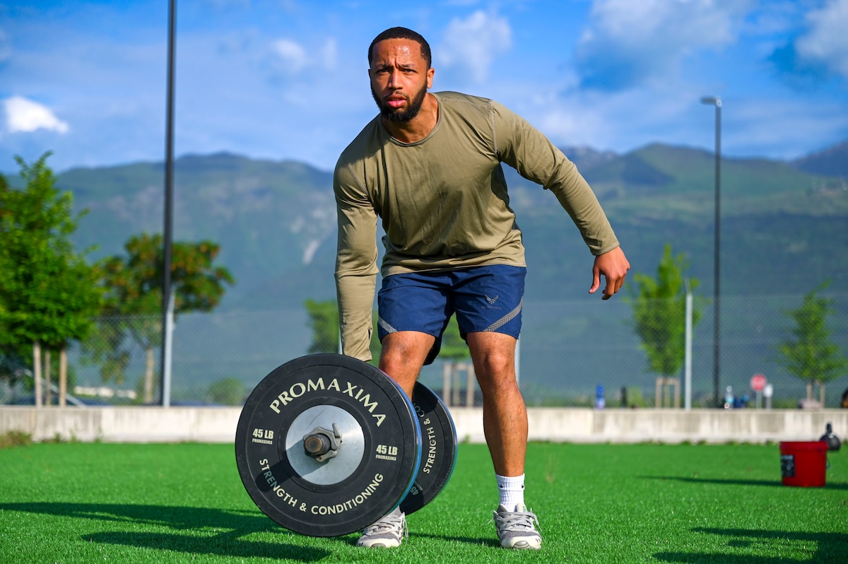 Man participates in weight lifting exercise.