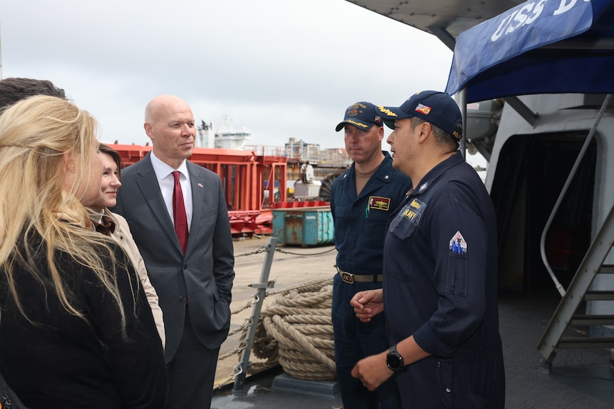 The honorable Marcus Micheli, Chargé d' Affaires, U.S. Embassy in The Hague, left is welcomed aboard the Arleigh Burke-class guided-missile destroyer USS Bulkeley (DDG 84), by Cmdr. Arturo Trejo., Commanding Officer of the Bulkeley, right, and Cmdr. Michael Schelcher, Executive Officer, center during At-Sea Demonstration (ASD) / Formidable Shield (FS) 2025
