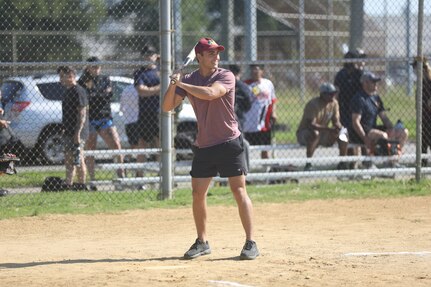 A Sailor assigned to USS Robert E. Simanek (ESB 7) participates in a game of softball against USS Richard M. McCool Jr. (LPD 29) Sailors during Surface Line Week 2025. June 2, 2025.