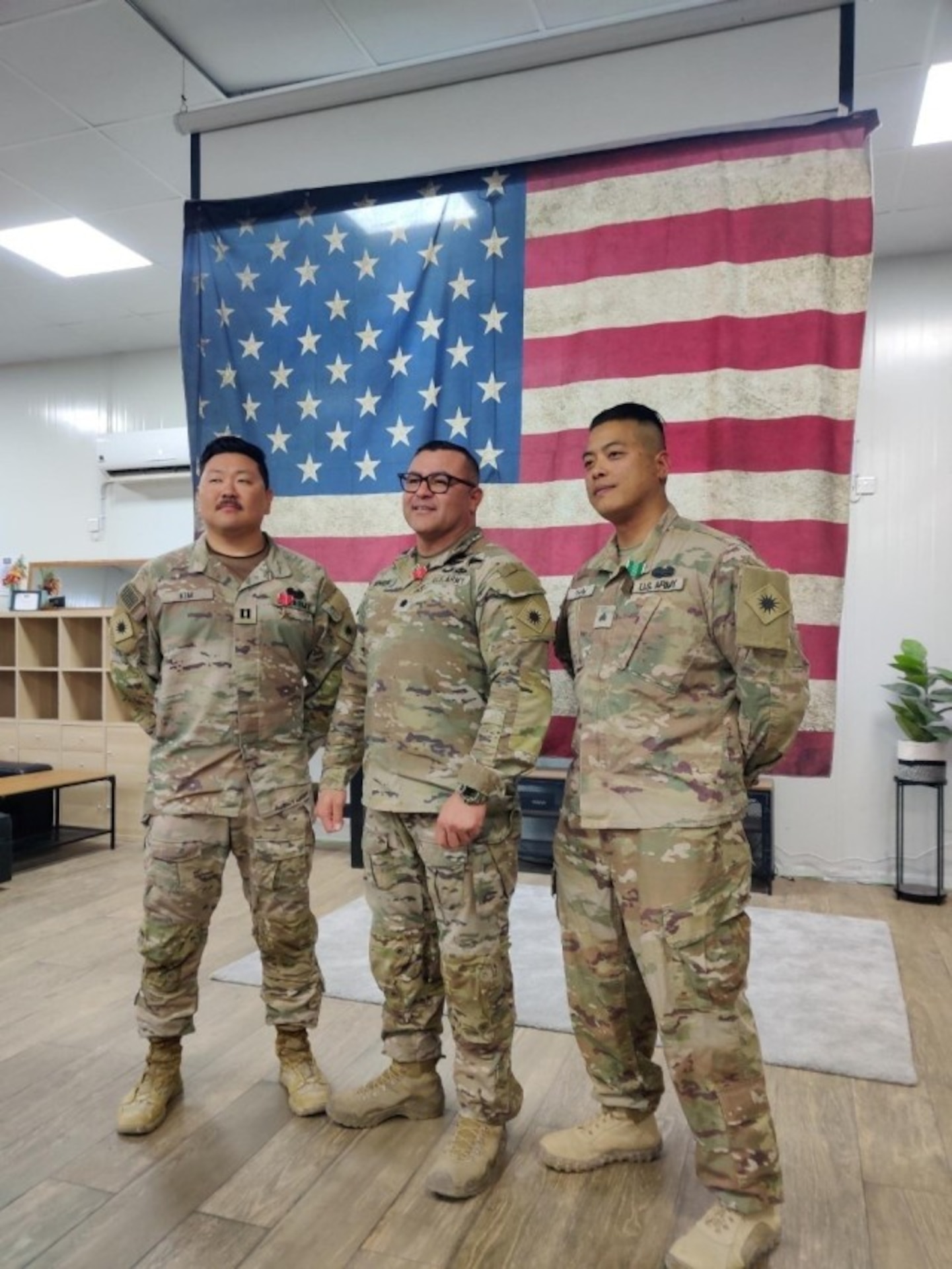 Capt. Jeffrey Kim (far left), Lt. Col. Enrique Monreal (middle), and Staff Sgt. Quan-Phillip Pham (far right) received end-of-tour awards for their deployment in the Middle East.