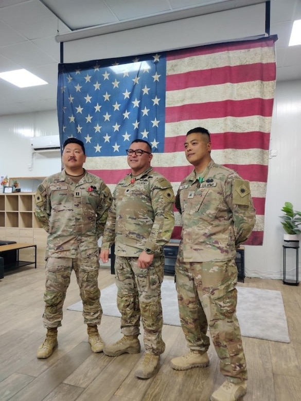 Capt. Jeffrey Kim (far left), Lt. Col. Enrique Monreal (middle), and Staff Sgt. Quan-Phillip Pham (far right) received end-of-tour awards for their deployment in the Middle East.