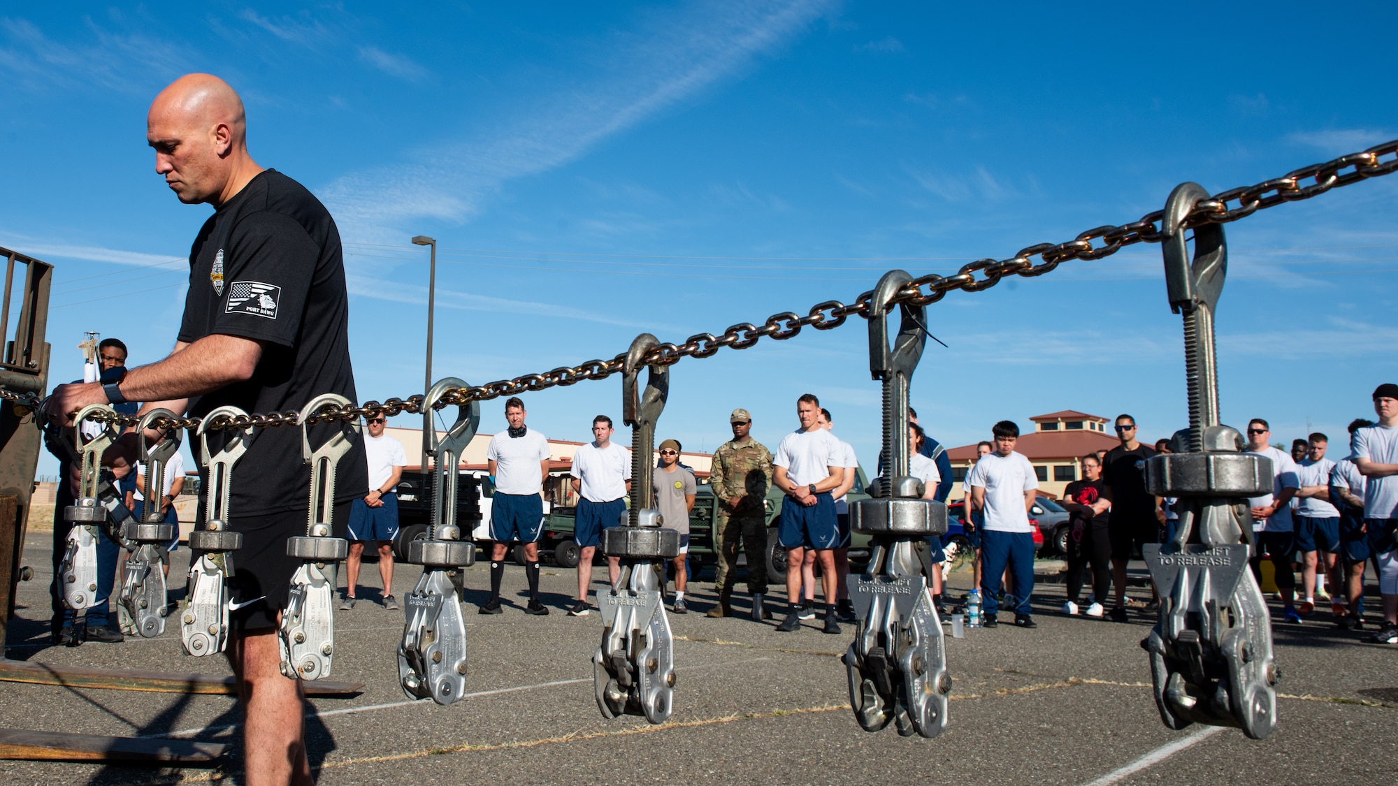 Airman hangs memorial device during ceremony
