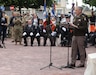 U.S. Army Lt. Gen. Charles Costanza, commanding general of V Corps, speaks beneath a statue of Gen. Dwight D. Eisenhower in Sainte-Mère-Église, France, June 2, 2025. The statue, unveiled in 2024, honors Eisenhower’s legacy and symbolizes Allied unity. (U.S. Army photo by Sgt. Tyler Brock)