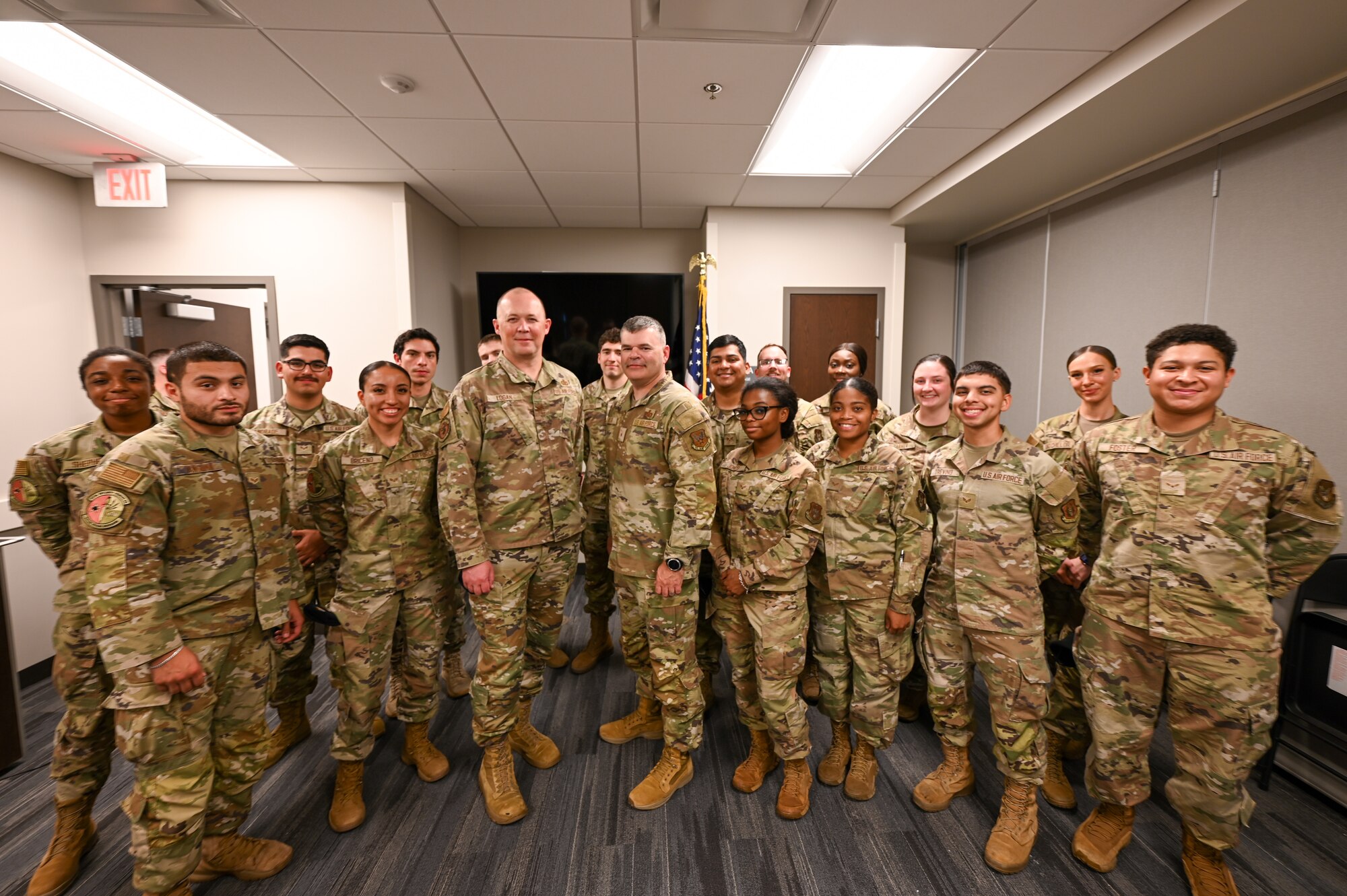 Brig. Gen. Brian A. Filler, Director of Security Forces, Deputy Chief of Staff for Logistics, Engineering and Force Protection, Headquarters U.S. Air Force, poses for a photo with Citizen Airmen defenders during a tour of the 433rd SFS at Joint Base San Antonio-Lackland, Texas, May 3, 2025.
