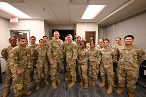 Brig. Gen. Brian A. Filler, Director of Security Forces, Deputy Chief of Staff for Logistics, Engineering and Force Protection, Headquarters U.S. Air Force, poses for a photo with Citizen Airmen defenders during a tour of the 433rd SFS at Joint Base San Antonio-Lackland, Texas, May 3, 2025.