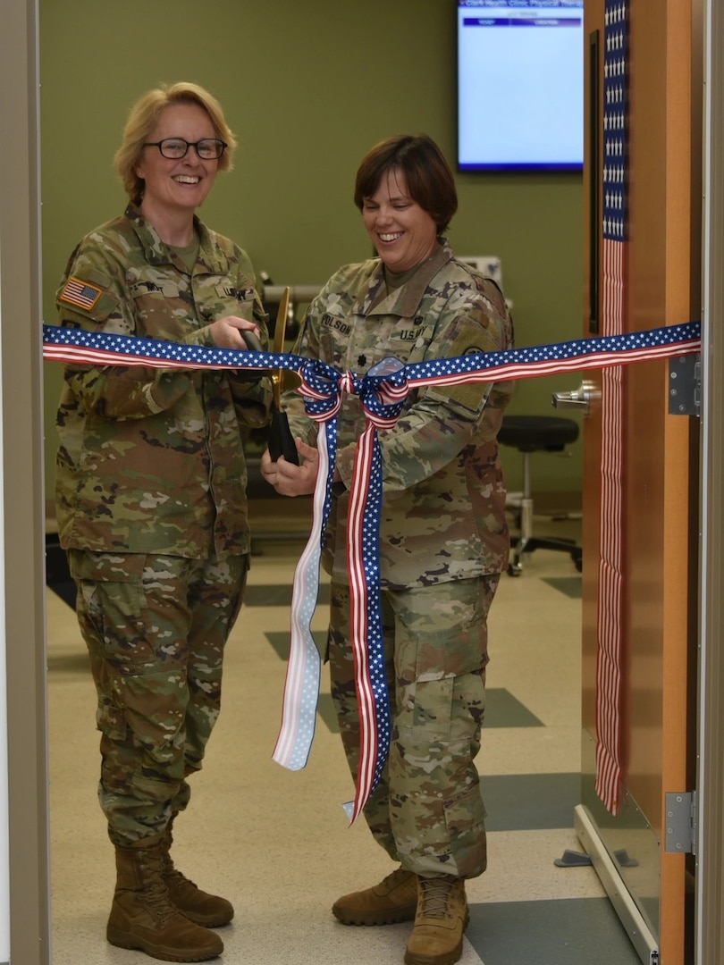 Col. Stephanie Mont, Womack Army Medical Center Hospital Commander and Lt. Col. (P) Melissa Folsom, director, Rehabilitation Services cut ribbon during May 14 ceremony. Clark Health Clinic Ribbon Cutting ceremony celebrates a nearly decades-long initiative to establish full scope Physical Therapy services embedded within the Clark Health Clinic, allowing Soldiers to complete their medical services within one footprint, Womack Army Medical Center, Fort Bragg, North Carolina