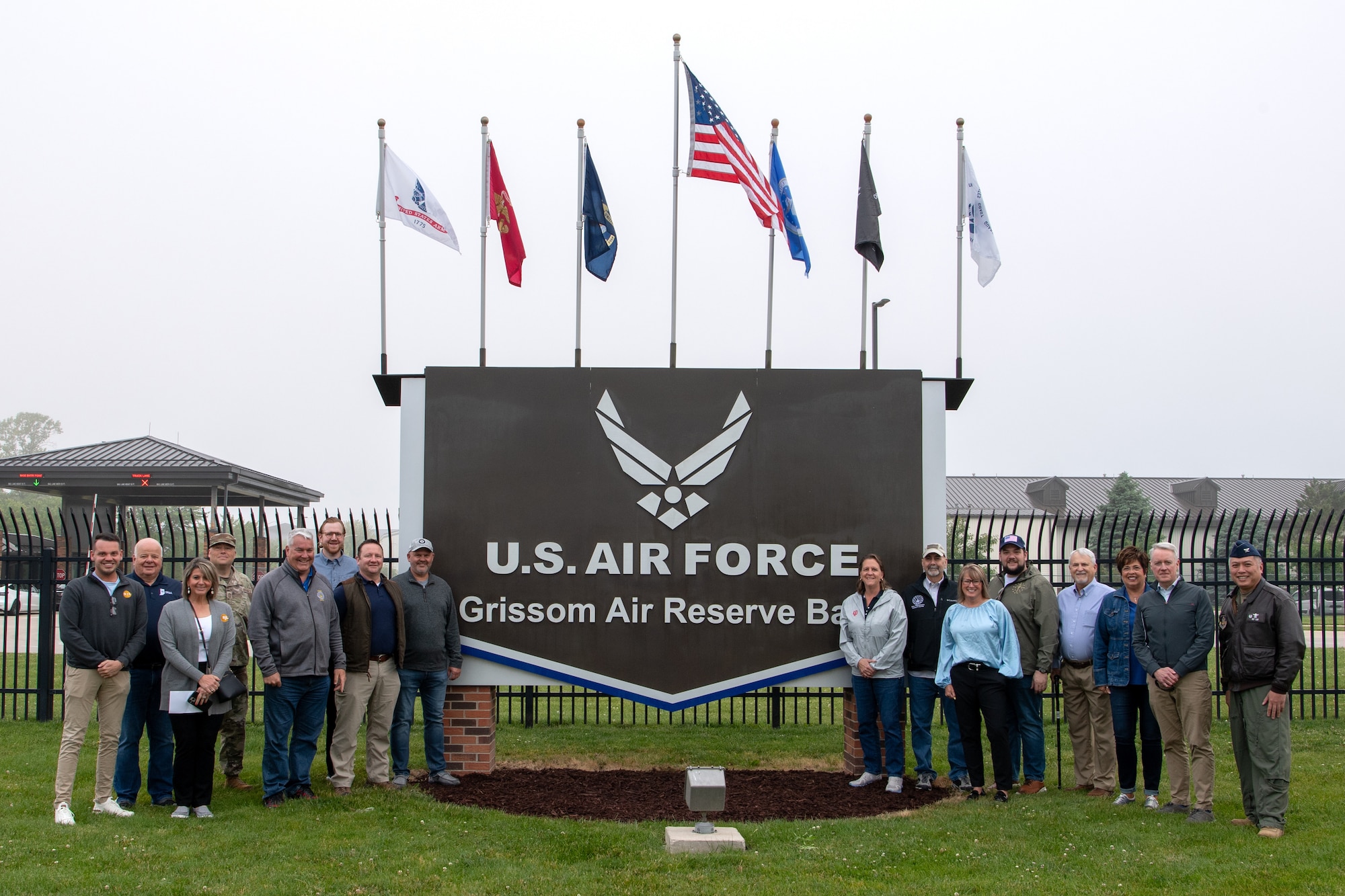 Indiana state legislators and leadership from the 434th Air Refueling Wing, Grissom Air Reserve Base, Ind. and 122nd Fighter Wing, Fort Wayne, Ind., pose for a photo at the Grissom main gate May 29, 2025. The wings partnered to showcase their capabilities and give legislators a better understanding of the needs and capabilities of both wings. (U.S. Air Force photo/Ben Mota)