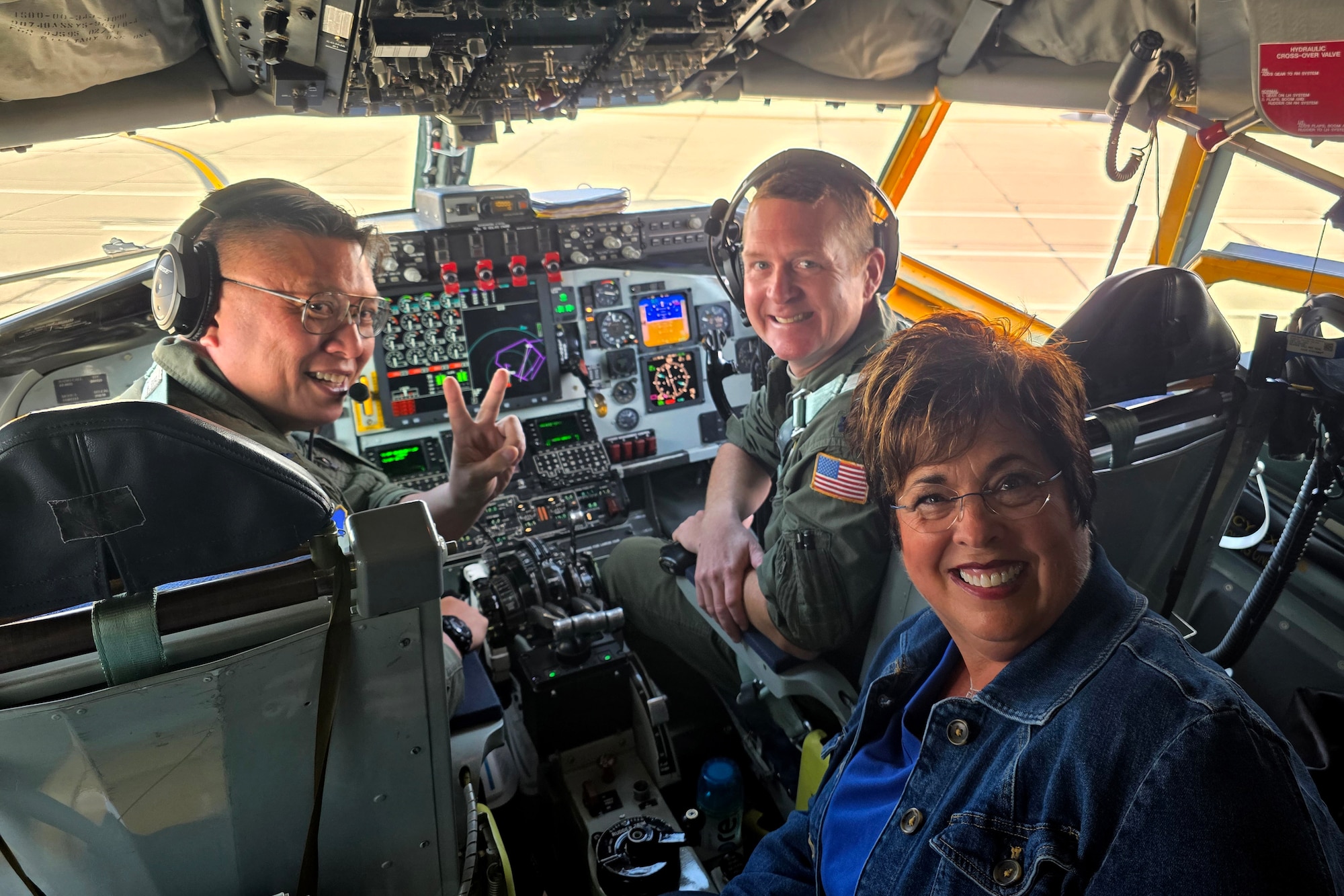 Indiana state Rep. Stacey Donato (front) poses for a photo with Col. Van Thai, 434th Air Refueling Wing commander, (left) and Lt. Col Joel, 434th ARW KC-135 Stratotanker Pilot and safety officer, prior to a legislator flight departing Grissom Air Reserve Base, Ind., May 29, 2025. During the mission, the group witnessed an aerial refueling between Grissom&#39;s KC-135 and F-16 Fighting Falcons from the 122nd Fighter Wing, Fort Wayne, Ind. (U.S. Air Force photo/Ben Mota)