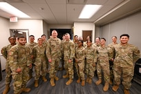 Brig. Gen. Brian A. Filler, Director of Security Forces, Deputy Chief of Staff for Logistics, Engineering and Force Protection, Headquarters U.S. Air Force, poses for a photo with Citizen Airmen defenders during a tour of the 433rd SFS at Joint Base San Antonio-Lackland, Texas, May 3, 2025.