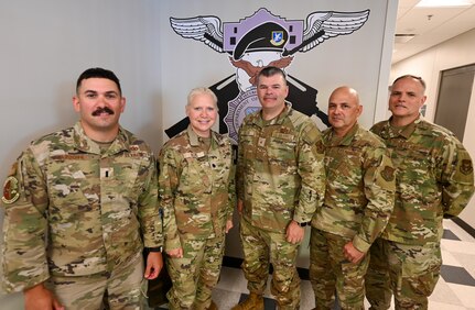 Brig. Gen. Brian A. Filler, Director of Security Forces, Deputy Chief of Staff for Logistics, Engineering and Force Protection, Headquarters U.S. Air Force, poses for a photo with 433rd Security Forces Squadron senior leaders during a visit to the 433rd SFS at Joint Base San Antonio-Lackland, Texas, May 3, 2025.
