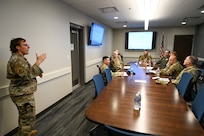 Senior Master Sgt. Catherine Falcon, 433rd Security Forces Squadron superintendent, briefs U.S. Air Force Brig. Gen. Brian A. Filler, Director of Security Forces, Deputy Chief of Staff for Logistics, Engineering and Force Protection, Headquarters U.S. Air Force, about the mission set of the 433rd SFS during a visit to the 433rd SFS at Joint Base San Antonio-Lackland, Texas, May 3, 2025.