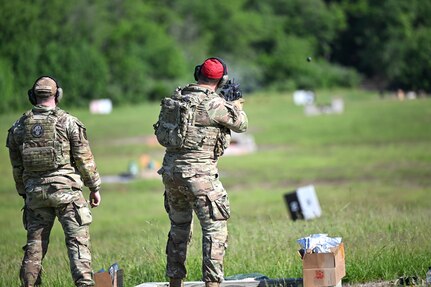 Two Airmen assigned to the 107th Attack Wing Security Forces Squadron begin qualification training with the M320 grenade launcher, May 20, 2025, Fort Indiantown Gap PA. The M320 offers many advantages from the typically used M203, namely in munition versatility, longer range, easier loading, and improved accuracy. New York Air National Guard photo by Capt Jason Carr