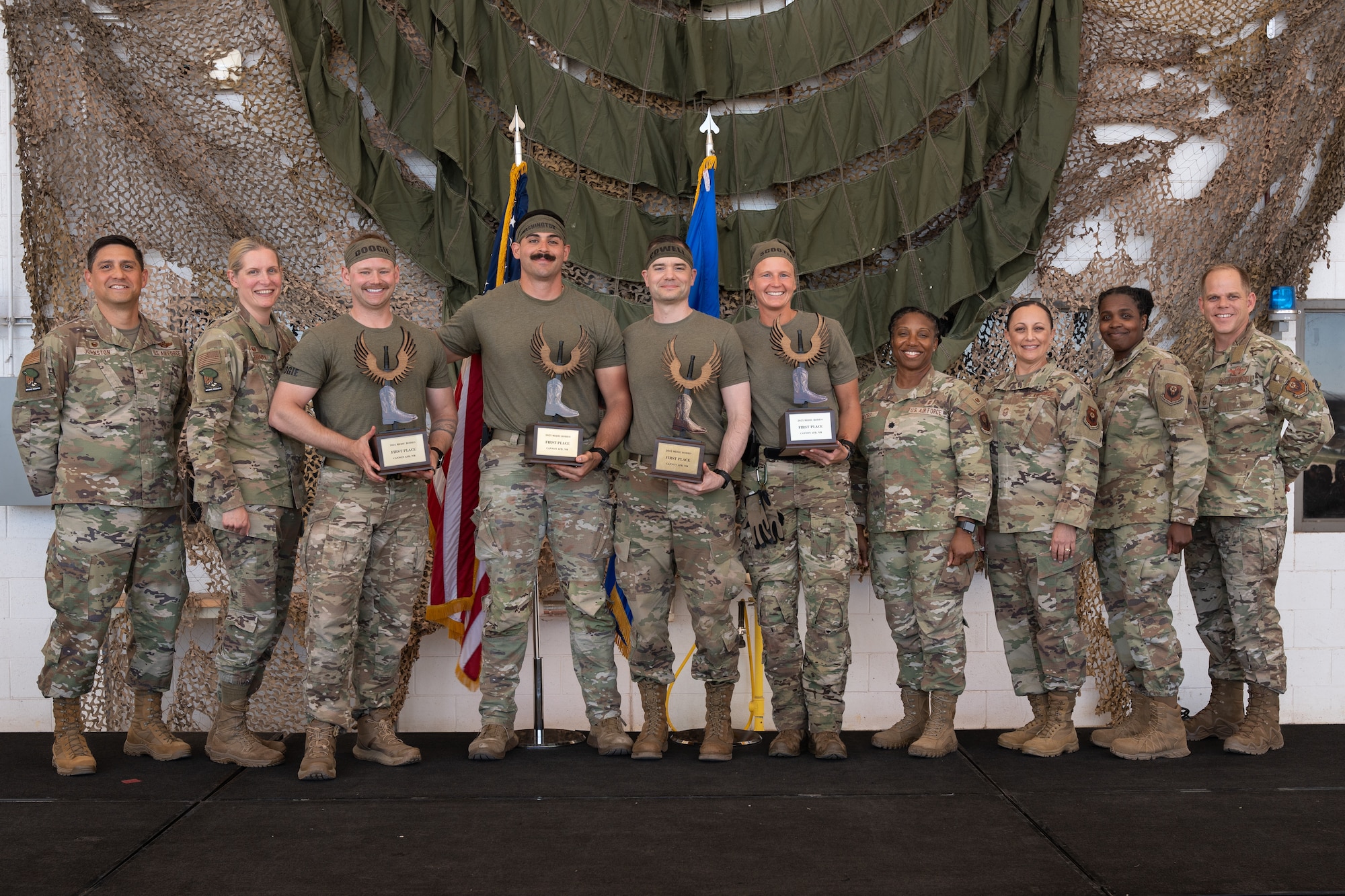 U.S. Air Force Airmen from the 711th Human Performance Wing, Wright Patterson Air Force Base, Ohio, pose with 27th Special Operations Wing leadership at Cannon Air Force Base, New Mexico.