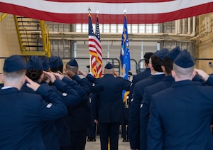 Airmen from the 5th Mission Support Group (5MSG) salute the colors during a change of command ceremony at Minot Air Force Base, North Dakota, June 2, 2025. As part of the ceremony, Airmen from the 5MSG rendered a salute to the outgoing and incoming commander. (U.S. Air Force photo by Airman 1st Class Wesley Davies)