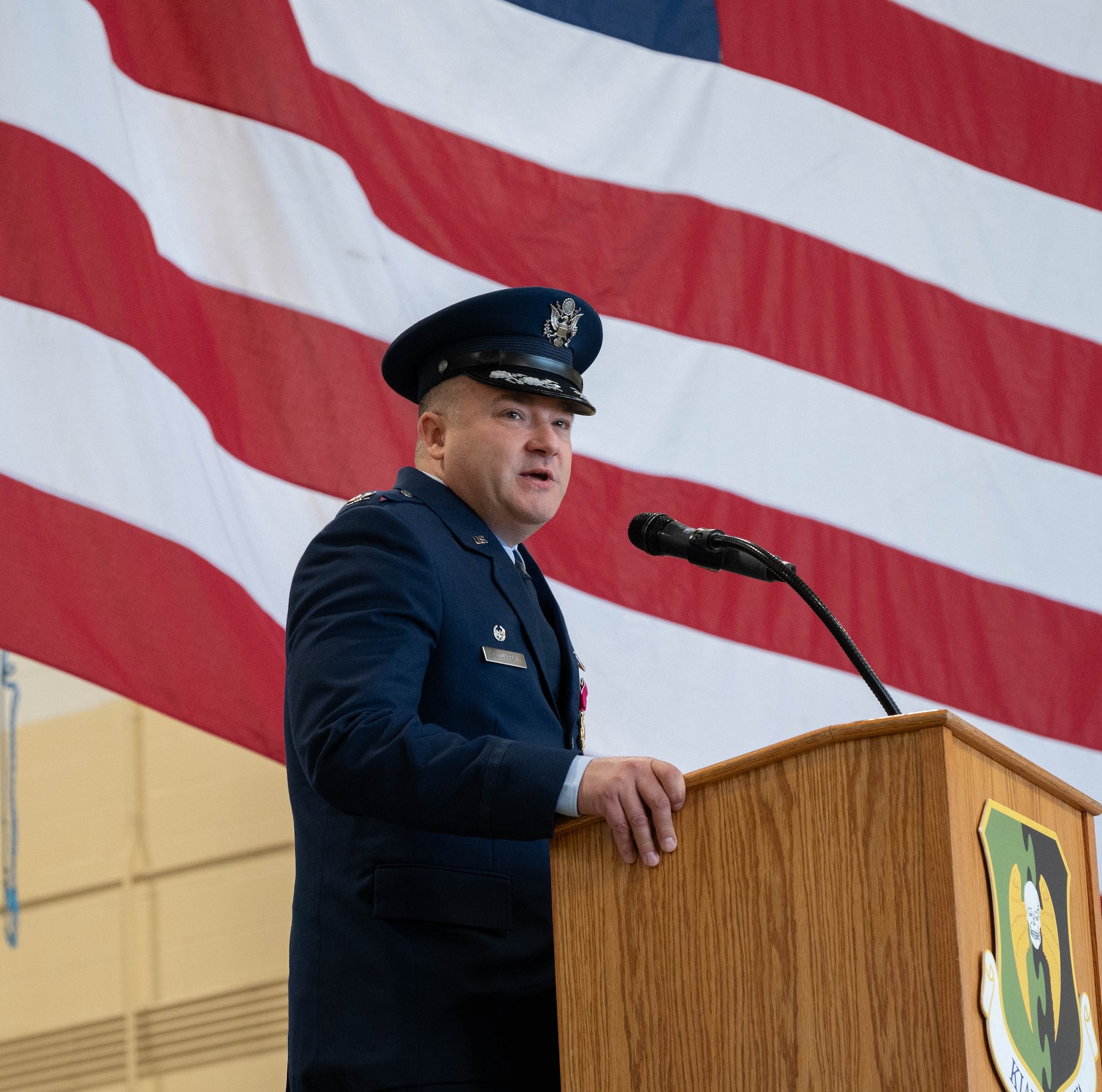 U.S. Air Force Col. Jerry Ottinger, 5th Mission Support Group (5MSG) commander, gives remarks during a change of command ceremony at Minot Air Force Base, North Dakota, June 2, 2025. Ottinger led six squadrons providing full spectrum operational and expeditionary support to the 5th Bomb Wing, the 91st Missile Wing and the 54th Helicopter Squadron, delivering global assurance, precision strike, and nuclear deterrence to six combatant commanders. (U.S. Air Force photo by Airman 1st Class Wesley Davies)