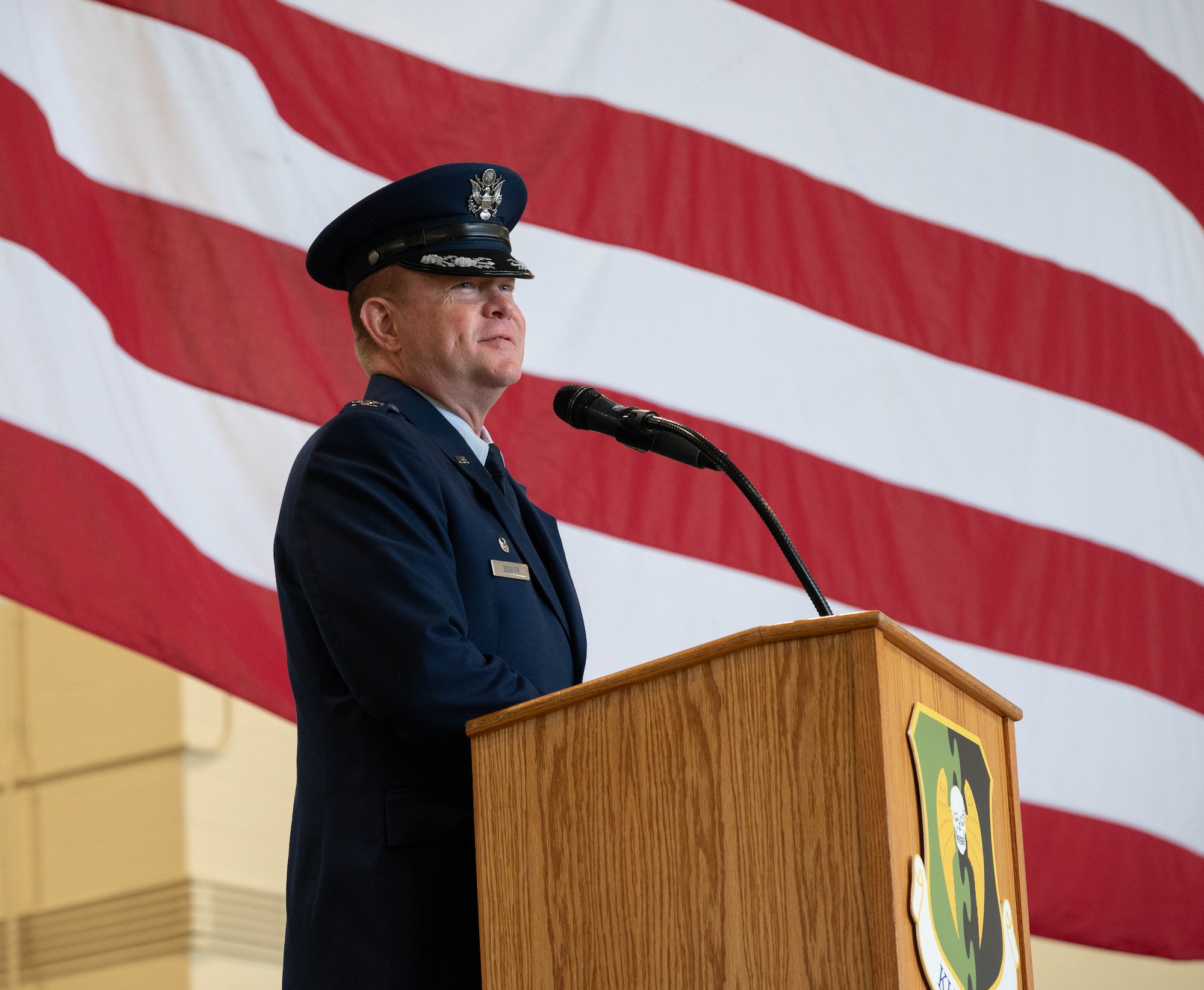 U.S. Air Force Col. Richard Zeigler, 5th Mission Support Group commander, speaks on becoming the incoming 5th Mission Support Group commander during a change of command ceremony at Minot Air Force Base, North Dakota, June 2, 2025. A change of command ceremony is a formal military tradition that signifies the transfer of authority and responsibility from one commander to another in a public event. (U.S. Air Force photo by Airman 1st Class Wesley Davies)