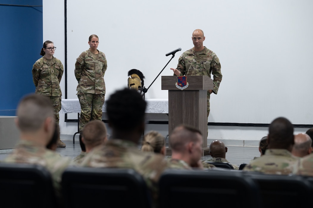 U.S. Air Force Col. Ross E. Dotzlaf, incoming 1st Expeditionary Theater Support Group commander, gives his first address during the 1st ETSG change of command ceremony within the U.S. Central Command area of responsibility, May 30, 2025. One of the 1st ETSG’s main objectives is campaigning and setting the theater for Agile Combat Employment. (U.S. Air Force photo by Senior Airman Dieondiere Jefferies)