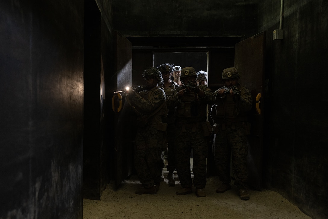 U.S. Marines with 2nd Battalion, 23rd Marines, forward deployed with 4th Marine Regiment, 3d Marine Division as part of the Unit Deployment Program, clear buildings during a live fire shoothouse as a part of military operations in urban terrain training during Korea Viper 25.4 at Camp Rodriguez, South Korea, May 24, 2025. Korea Viper is a recurring exercise series that demonstrates the Republic of Korea and U.S. Marine Corps' ability to respond decisively in the region as a singular, unified force while strengthening relationships and trust between the two allies. (U.S. Marine Corps photo by Lance Cpl. Tucker Mocan)