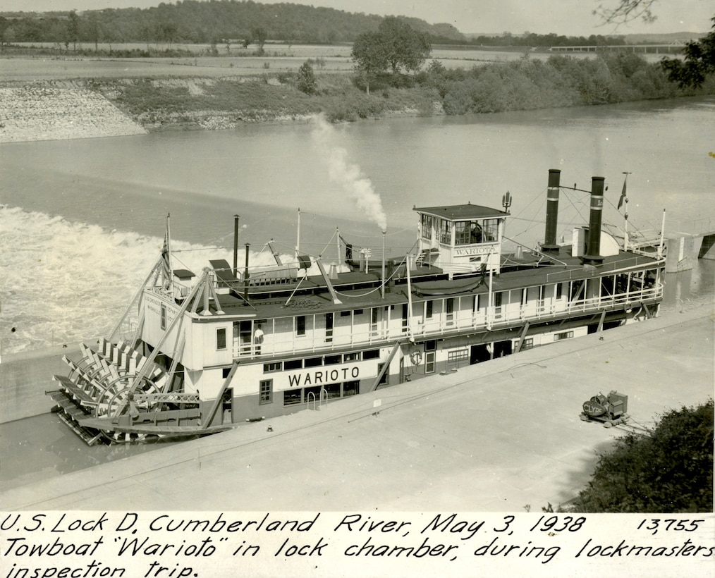 Towboat Warioto locks through Lock D May 3, 1938, on the Cumberland River in Dover, Tennessee. The U.S. Army Corps of Engineers Nashville District built the lock and dam to establish a navigation channel. The old locks and dams were later replaced by today's modern dams. (USACE Photo)