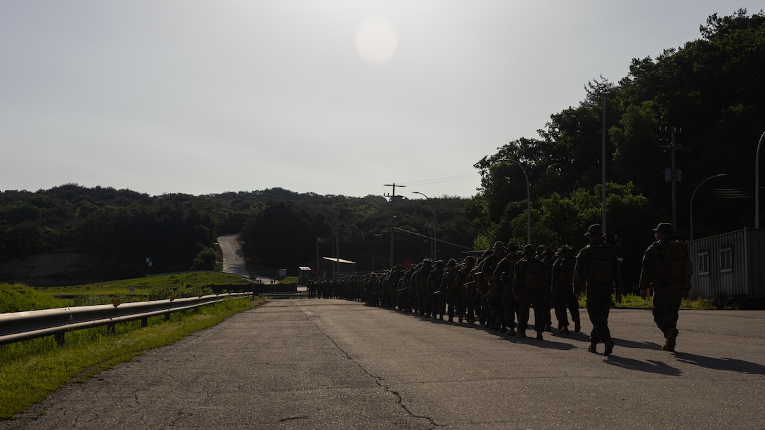 U.S. Marines with 2nd Battalion, 23rd Marines, forward deployed with 4th Marine Regiment, 3d Marine Division as part of the Unit Deployment Program, hike to a range during Korea Viper 25.4 at Camp Rodriguez, South Korea, May 22, 2025. Korea Viper is a recurring exercise series that demonstrates the Republic of Korea and U.S. Marine Corps' ability to respond decisively in the region as a singular, unified force while strengthening relationships and trust between the two allies. (U.S. Marine Corps photo by Lance Cpl. Tucker Mocan)