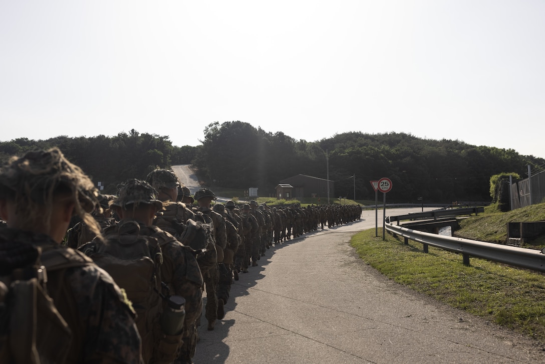 U.S. Marines with 2nd Battalion, 23rd Marines, forward deployed with 4th Marine Regiment, 3d Marine Division as part of the Unit Deployment Program, hike to a range during Korea Viper 25.4 at Camp Rodriguez, South Korea, May 22, 2025. Korea Viper is a recurring exercise series that demonstrates the Republic of Korea and U.S. Marine Corps' ability to respond decisively in the region as a singular, unified force while strengthening relationships and trust between the two allies. (U.S. Marine Corps photo by Lance Cpl. Tucker Mocan)