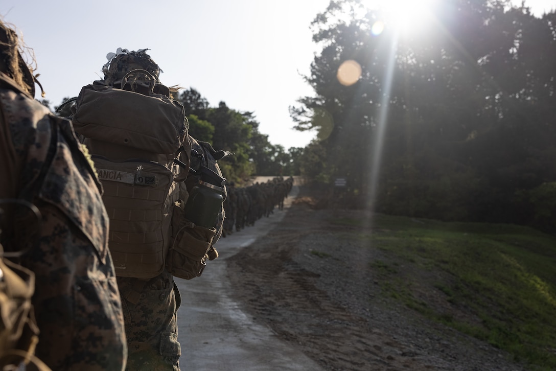 U.S. Marines with 2nd Battalion, 23rd Marines, forward deployed with 4th Marine Regiment, 3d Marine Division as part of the Unit Deployment Program, hike to a range during Korea Viper 25.4 at Camp Rodriguez, South Korea, May 22, 2025. Korea Viper is a recurring exercise series that demonstrates the Republic of Korea and U.S. Marine Corps' ability to respond decisively in the region as a singular, unified force while strengthening relationships and trust between the two allies. (U.S. Marine Corps photo by Lance Cpl. Tucker Mocan)