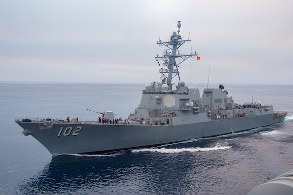 The Arleigh Burke-class guided-missile destroyer USS Sampson (DDG 102) steams alongside the aircraft carrier USS Nimitz (CVN 68) in the Pacific Ocean, Oct. 5, 2024. Nimitz is underway in 3rd Fleet conducting routine training operations. (U.S. Navy photo by Mass Communication Specialist Seaman Joseph M. Paolucci)