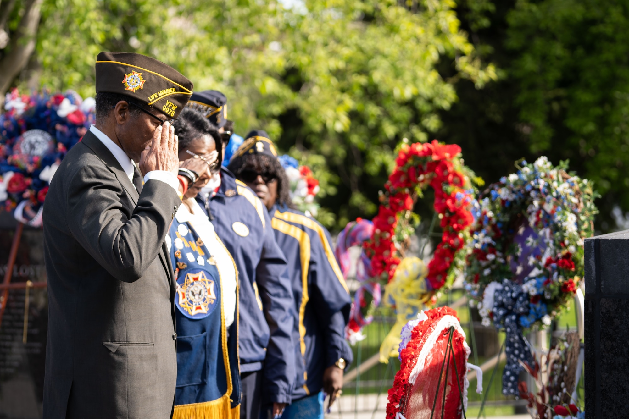 Families of fallen service members pay their respects at the Anchorage Remembers Memorial Day Ceremony at Delaney Park, Anchorage, Alaska on May 26, 2025.