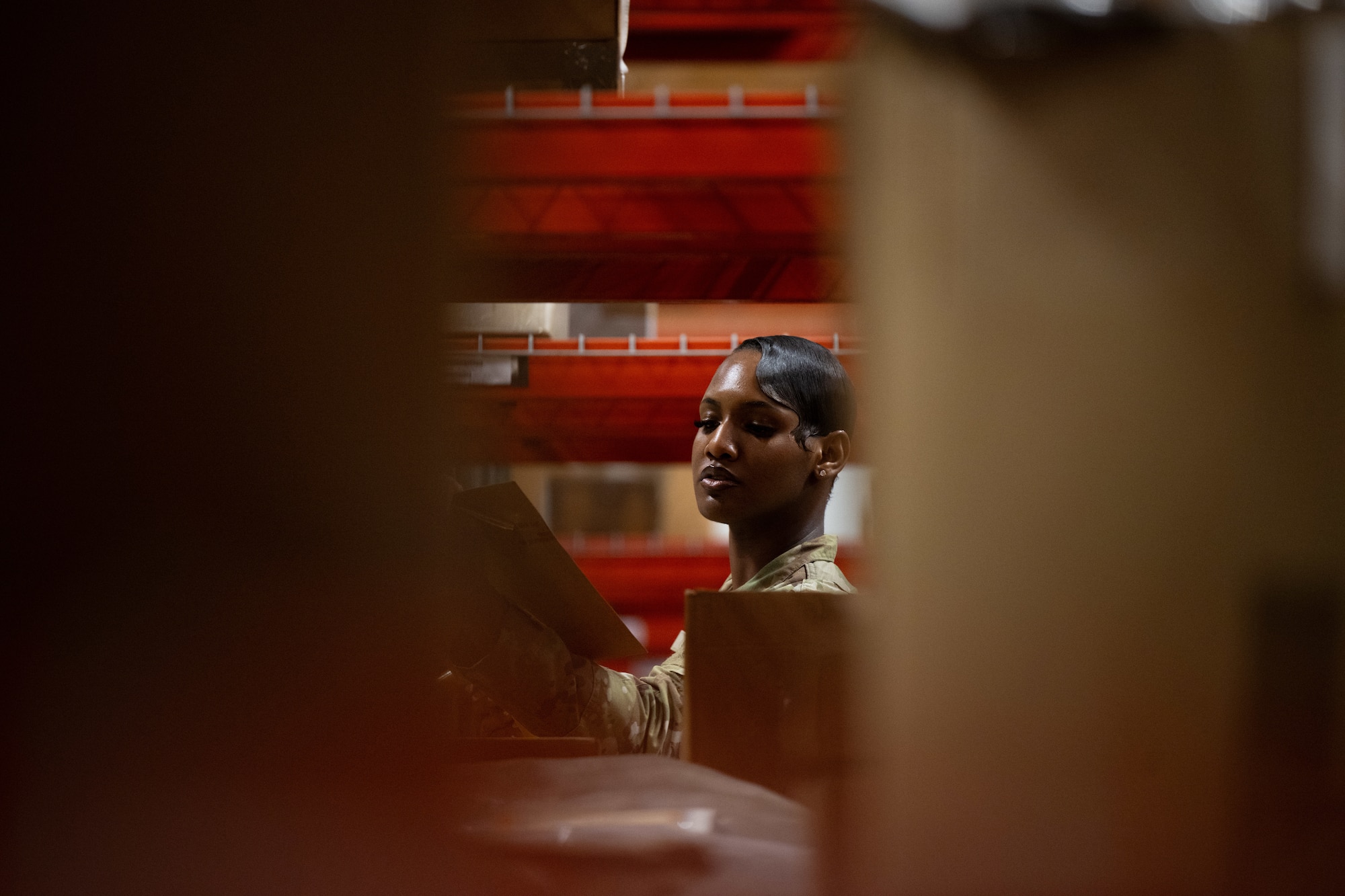 U.S. Airman 1st Class Shanelle King, 436th Logistics Readiness Squadron material management inspection apprentice, reads off a clipboard during parts inspection at Dover Air Force Base, Delaware, June 2, 2025. As part of the Material Management Flight within the 436th LRS, King is responsible for ensuring compliance and accountability across the base by conducting shelf-life inspections, functional checks and Care of Supplies in Storage (COSIS). She also trains and certifies limited inspectors to maintain readiness across the unit. (U.S. Air Force photo by Staff Sgt. Marco A. Gomez)