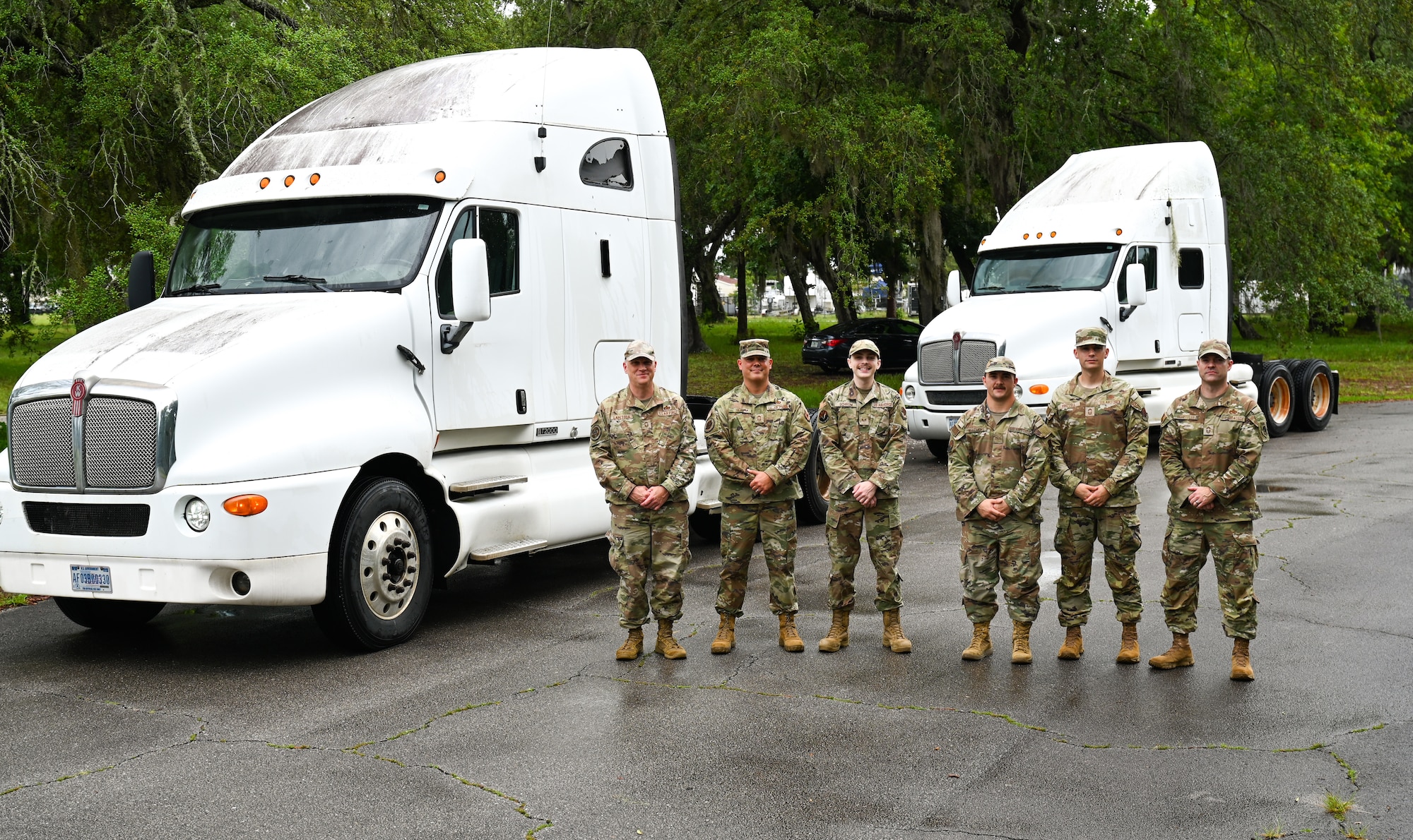 Visiting A2 maintenance functional managers and wing leadership pose for a group photo in front of the 87th Electronic Warfare Squadron’s semi trucks during a wing immersion tour at Eglin Air Force Base, Fla., May 28, 2025. The immersion lasted two days and allowed the visiting functional managers to engage with all A2s across the 350th Spectrum Warfare Wing to learn more about their unique electromagnetic warfare specific duties. (Courtesy Photo)