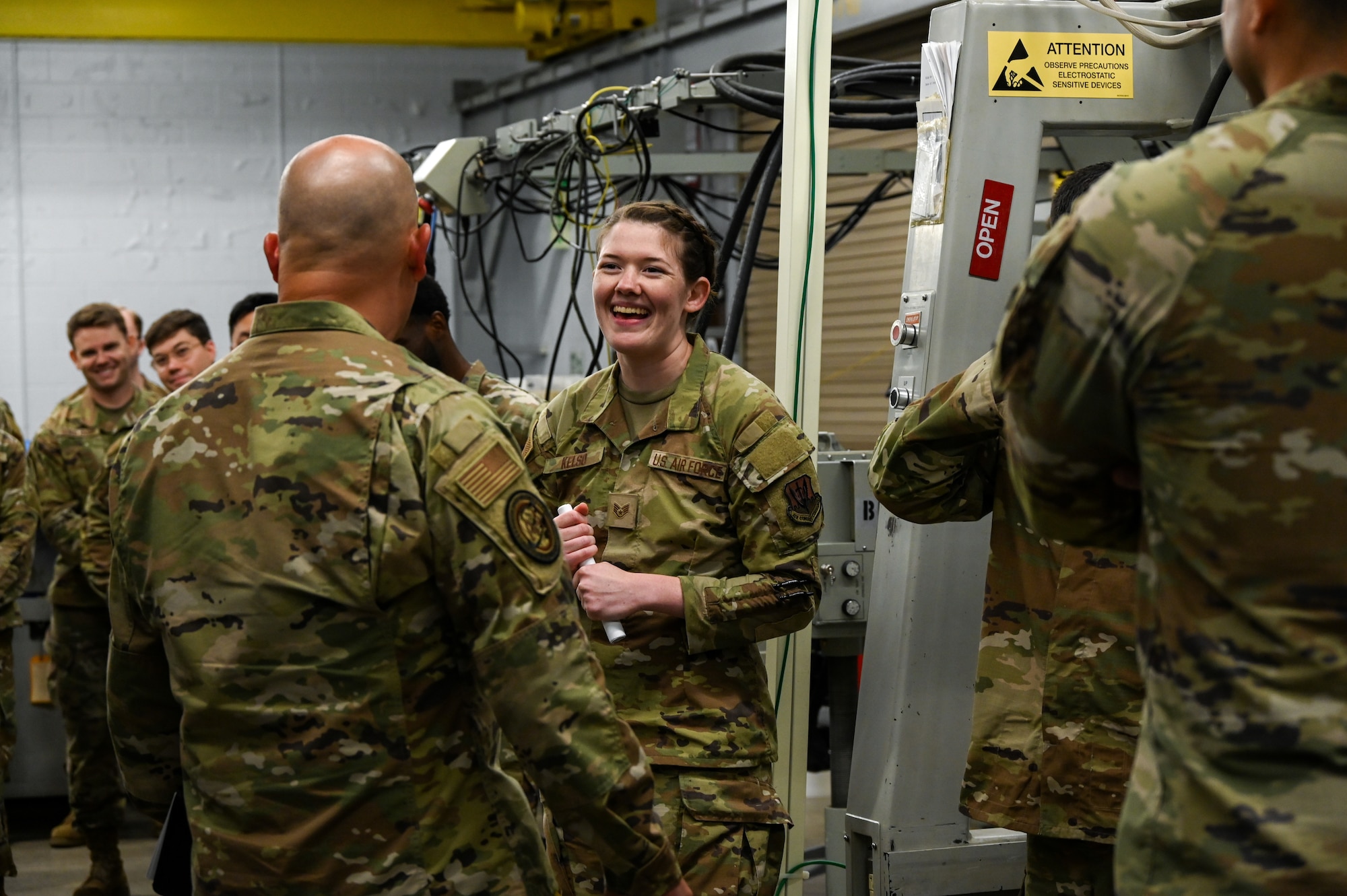 U.S. Air Force Staff Sgt. Emily Kelso, 36th Electronic Warfare Squadron electromagnetic warfare systems expeditor, briefs visiting A2 maintenance functional managers on the pod shops mission during a wing immersion at Eglin Air Force Base, Fla., May 28, 2025. The functional managers visited to learn more about the unique 2A mission at the wing as it pertains to support the Air Force’s electromagnetic warfare mission requirements. (U.S. Air Force photo by Capt. Benjamin Aronson)