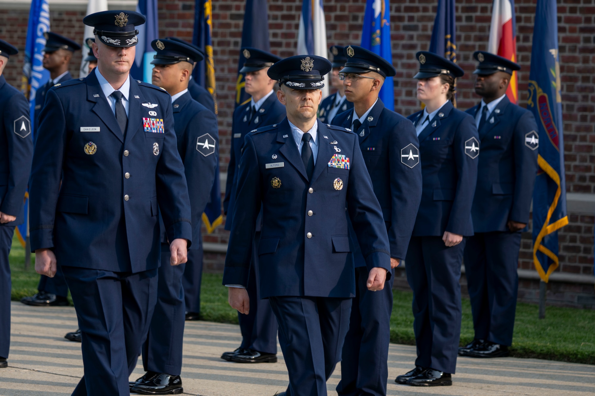 Air and Space Force personnel perform ceremonial assumption of command in dress uniform.