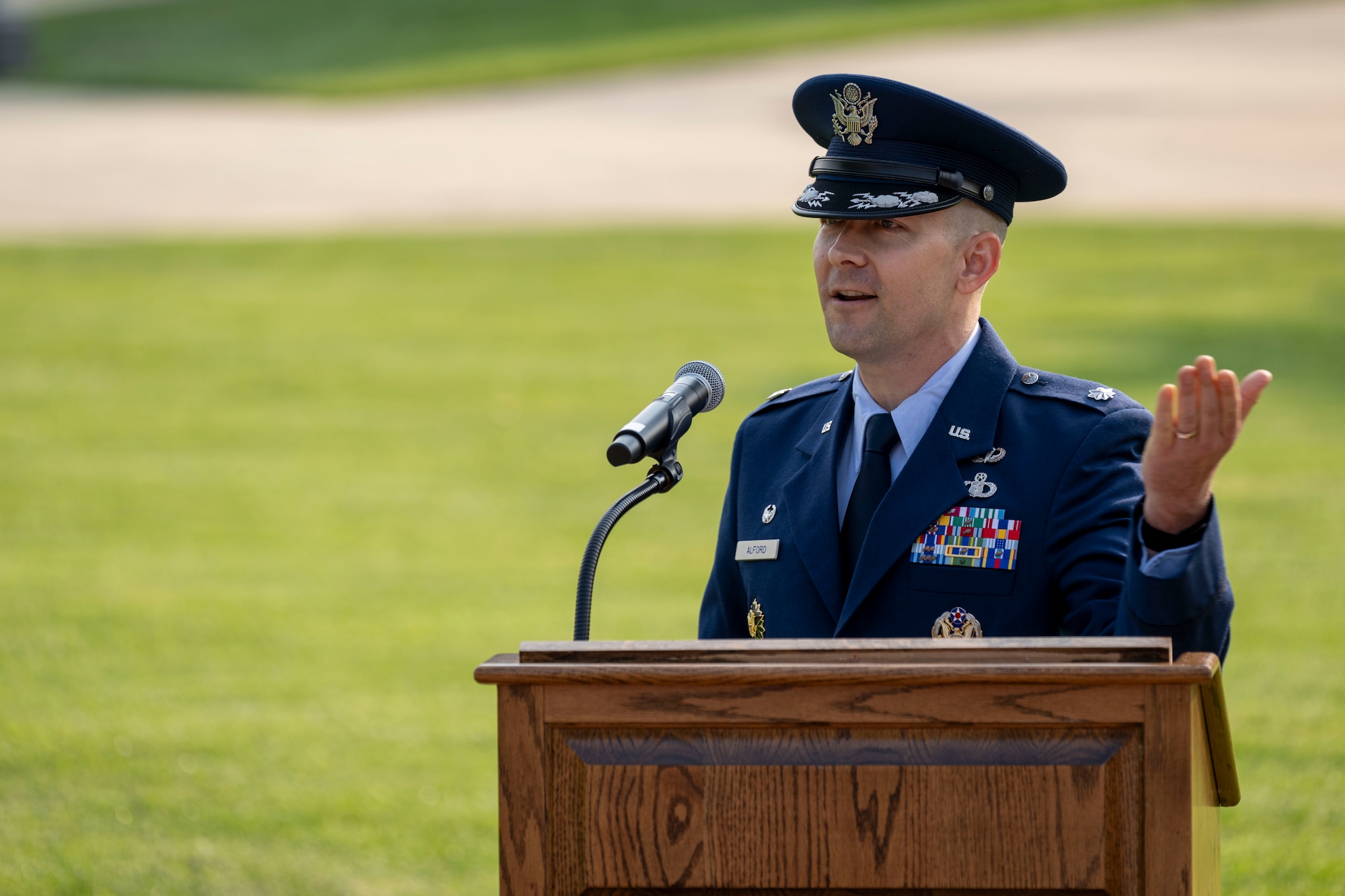 Air and Space Force personnel perform ceremonial assumption of command in dress uniform.