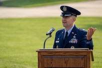 Air and Space Force personnel perform ceremonial assumption of command in dress uniform.