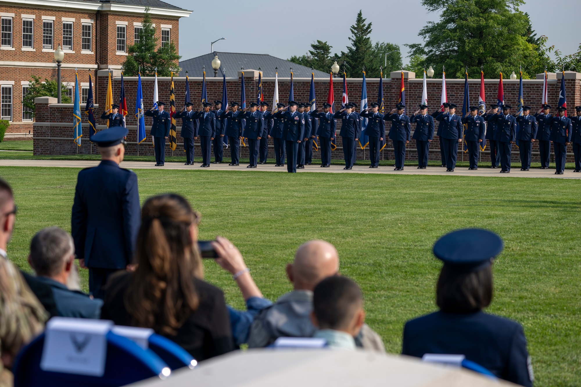 Air and Space Force personnel perform ceremonial assumption of command in dress uniform.