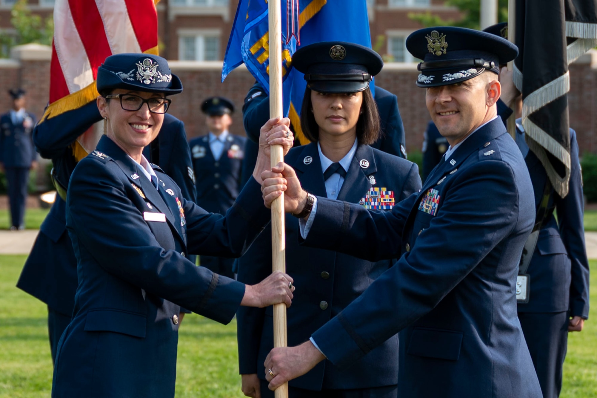 Air and Space Force personnel perform ceremonial assumption of command in dress uniform.