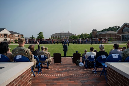 Air and Space Force personnel perform ceremonial assumption of command in dress uniform.