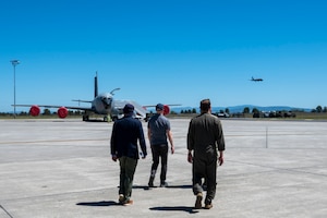 People walk on the flightline