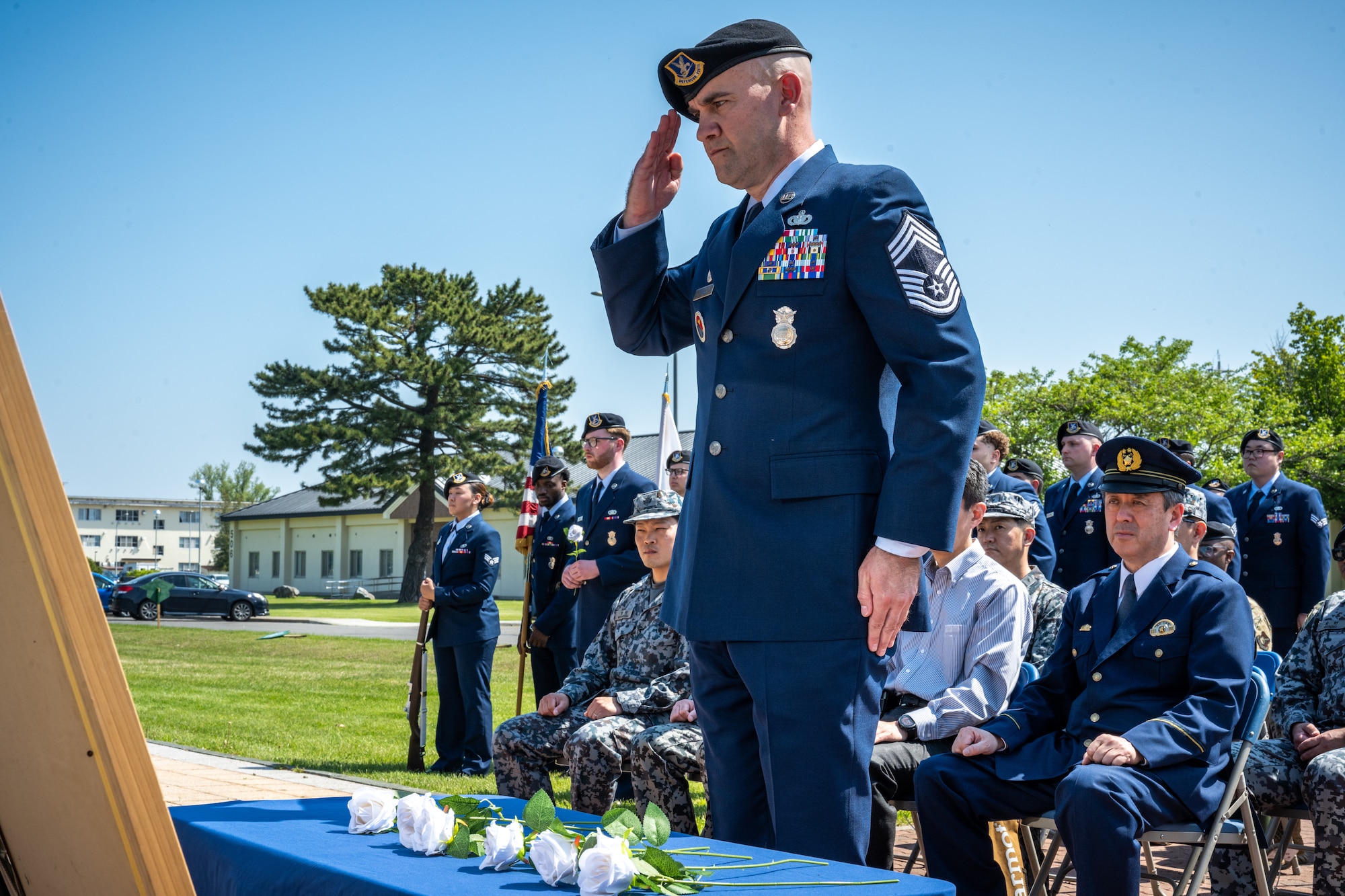 Airman salutes to a memorial