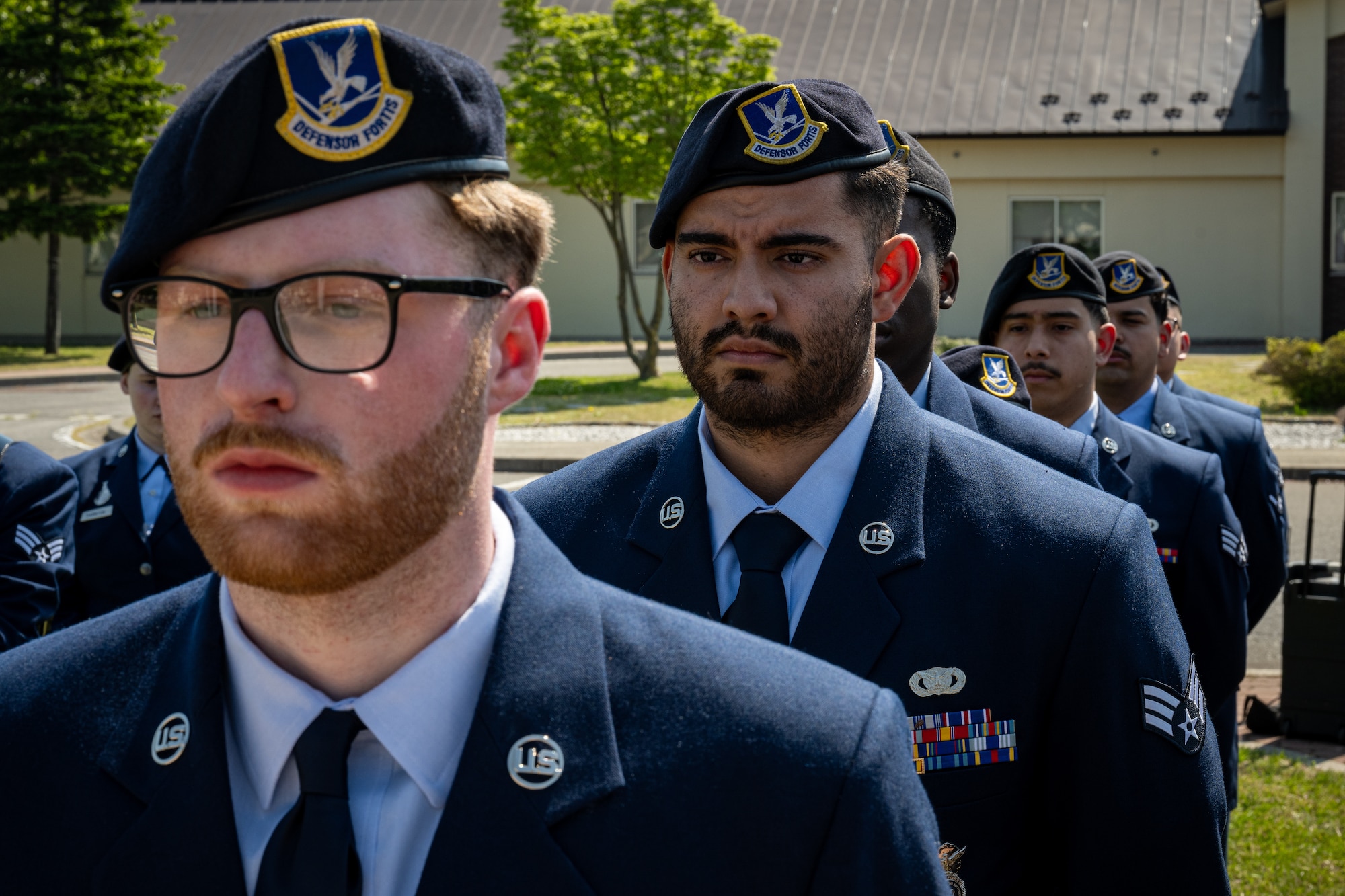 Airmen stand in attention
