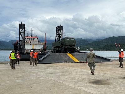 Soldiers from 5-3 Long Range Fires Battalion unload an M142 HIMARS from a Philippine Naval vessel during sea to shore landing training as part of Exercise Salaknib 2025 on May 31.